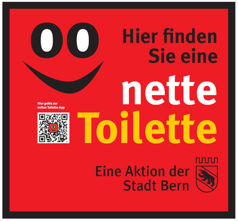 Ein roter Aufkleber weist den Weg zur "Netten Toilette"